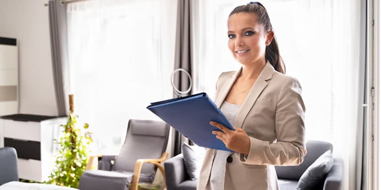 Real estate property manager inspecting a house